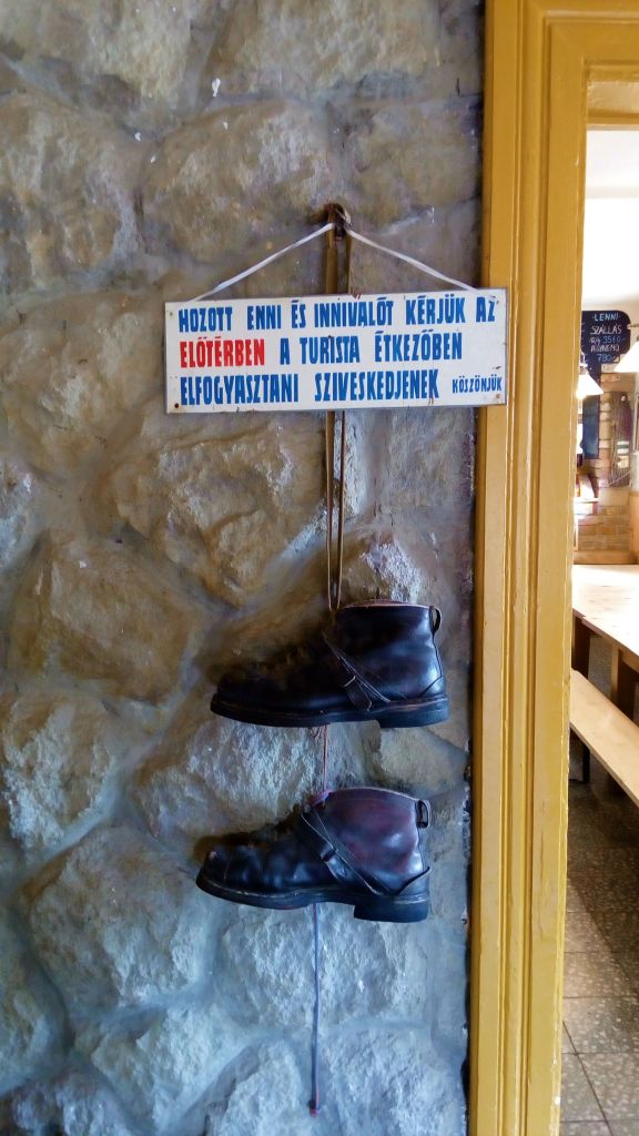 Old sign next to the entrance of the house