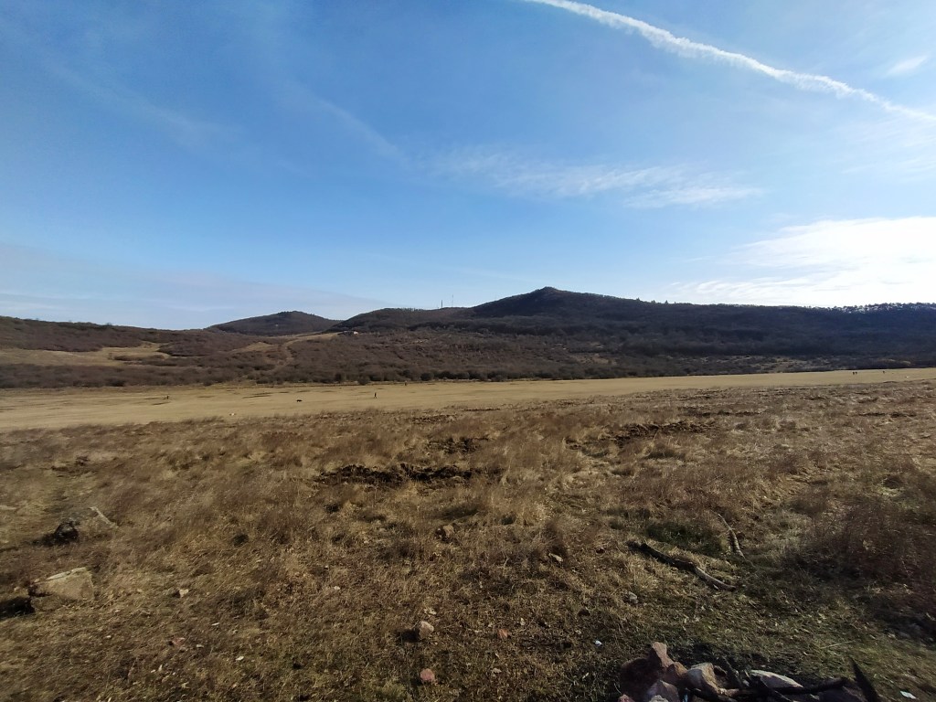 Airfield at Hármashatárhegy with mountains in the background