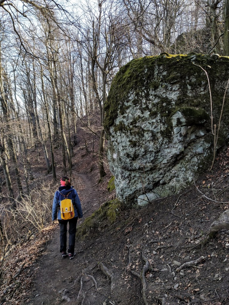 Walking at the feet of a rock formation