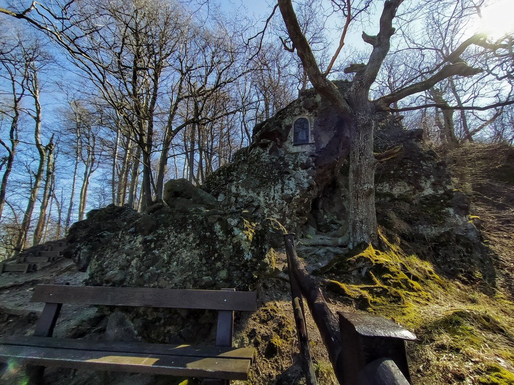 Benches at the foot of a cliff